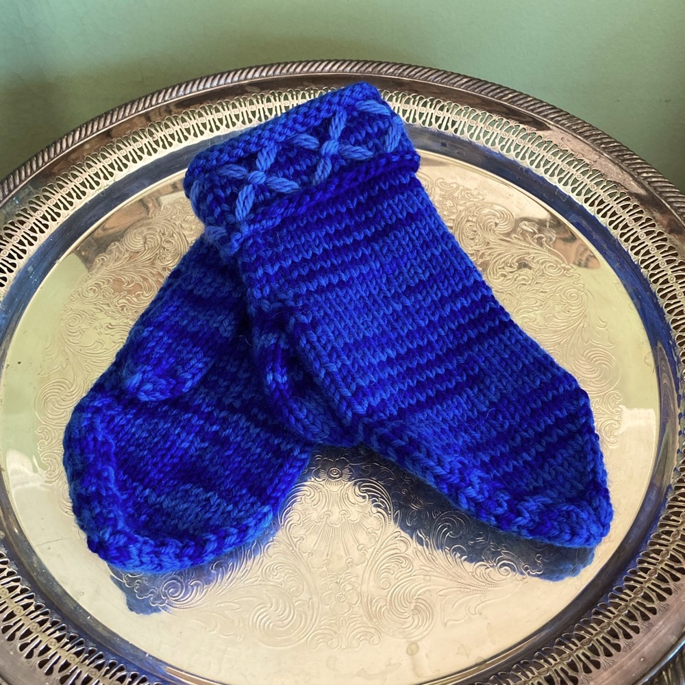 Hand knitted wool mittens with decorated cuffs